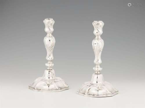 A pair of Mons silver candlesticks