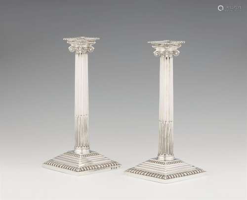 A pair of George III London silver candlesticks