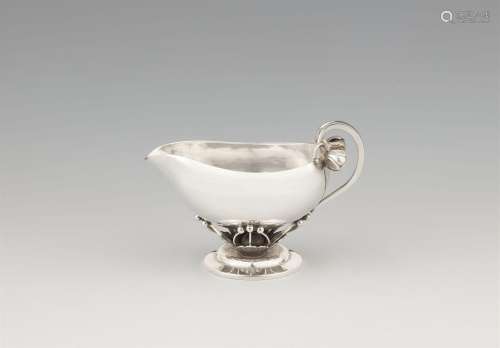 A Georg Jensen silver cream jug, no. 235