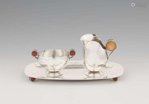 An Art Deco silver cream set