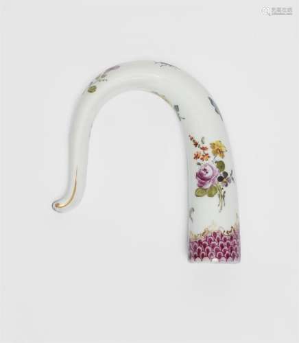 A curved porcelain walking cane topper with purple scale-pat...