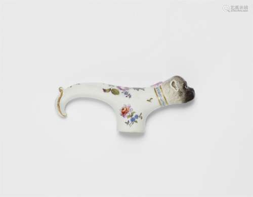 A porcelain pug dog walking cane topper