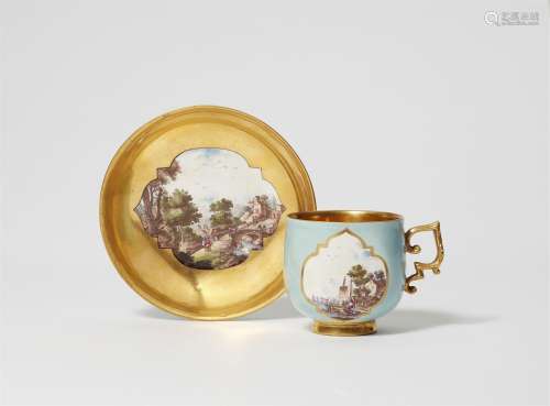 A Meissen porcelain cup and saucer with landscapes