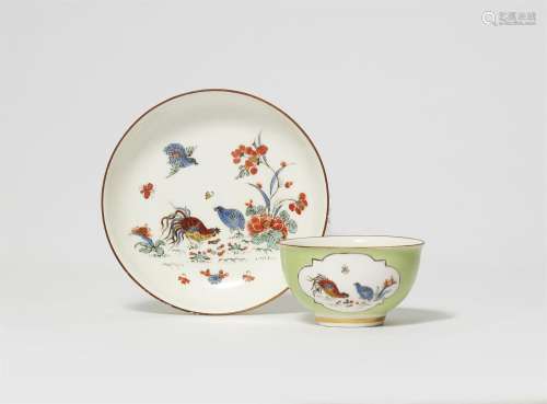 A Meissen porcelain tea bowl and saucer with coloured ground...