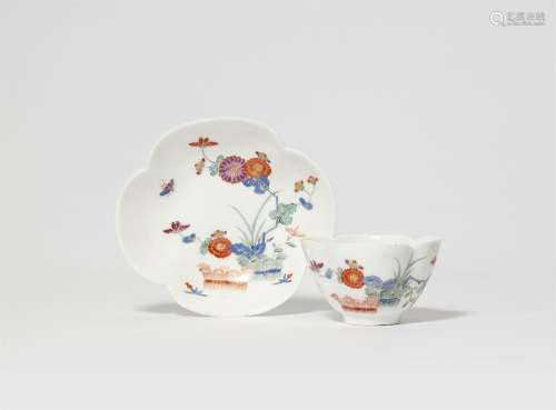A Meissen porcelain tea bowl and saucer with peony and rice ...