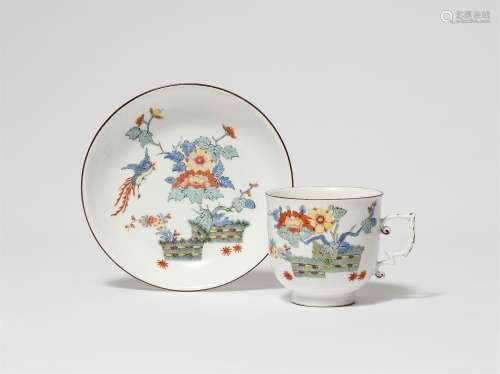 A Meissen porcelain tea bowl and saucer with Hôô birds, peon...