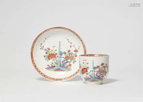 A Meissen porcelain cup and saucer with Chinoiserie bamboo a...