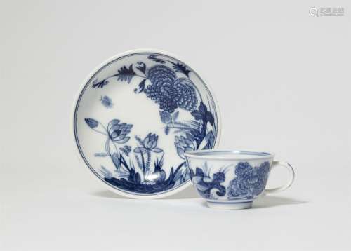A Meissen porcelain cup and saucer with lotus flower and chr...