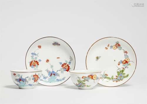 Two Meissen porcelain tea bowls and saucers with chrysanthem...