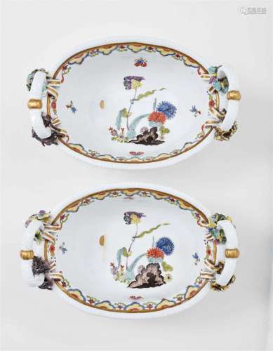 A pair of Meissen porcelain baskets with mascarons represent...