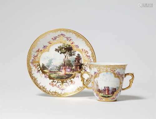 A Meissen porcelain beaker and saucer with landscape decor