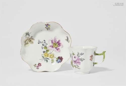 A Meissen porcelain cup and saucer with floral decor