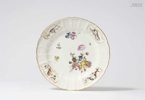 A Meissen porcelain plate from a service with native birds a...