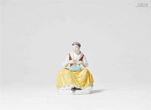A rare Meissen porcelain figure of a seamstress