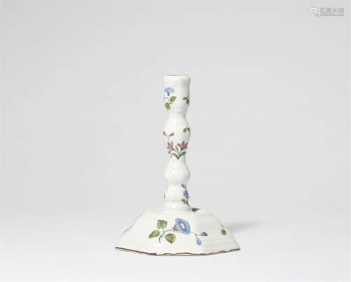 A Strasbourg faience candlestick with "fleurs esseulées...