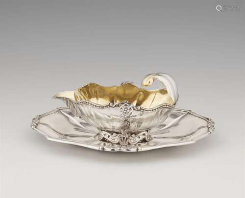 A rare Maastricht silver gravy boat and stand