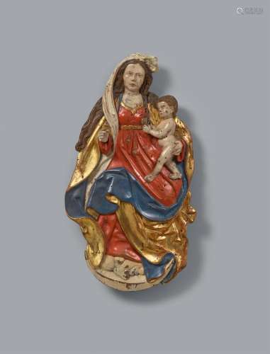 A Franconian carved wood relief of the Virgin and Child, aro...