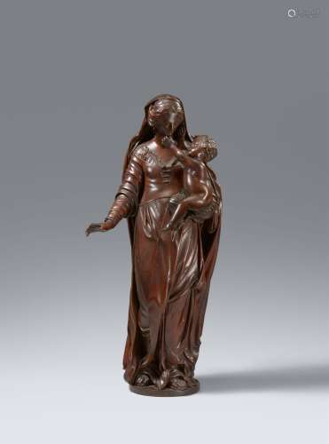 A carved figure of the Virgin and Child by Joseph de Pues,, ...