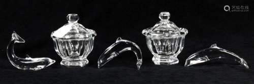 Three Baccarat glass dolphins and two Baccarat Bretagne cove...