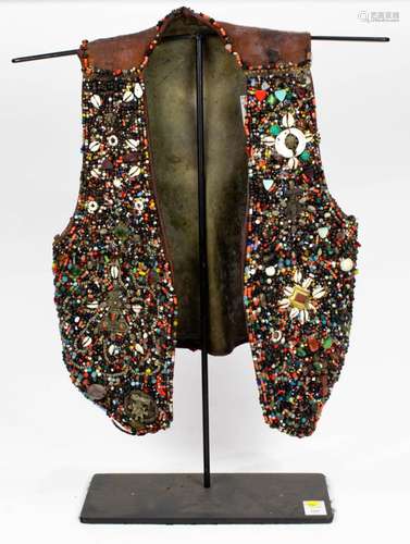 Berber beaded leather vest on stand