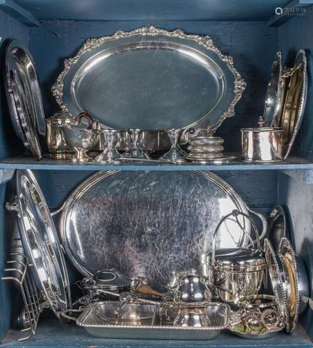 Two shelves of silverplate hollow ware items, including a te...