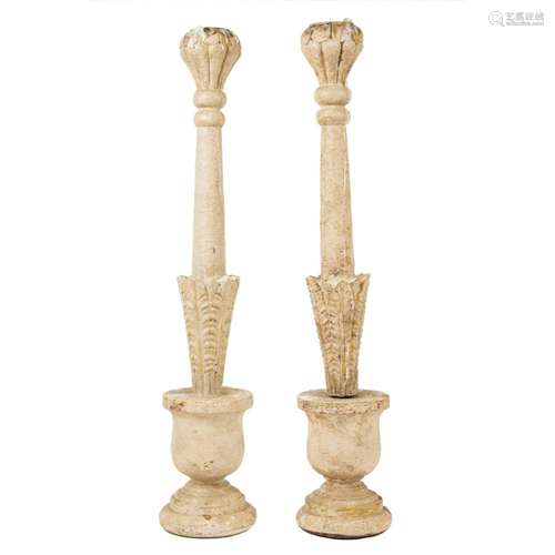 A pair of paint decorated candlesticks in a baluster form