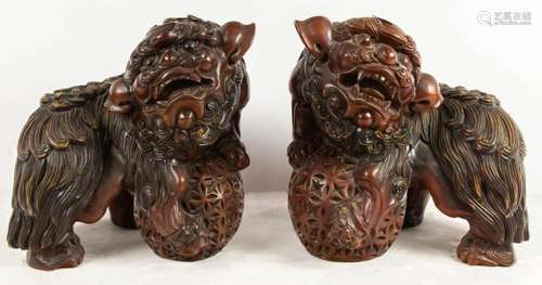 Pair of Chinese elmwood Fu lion figures