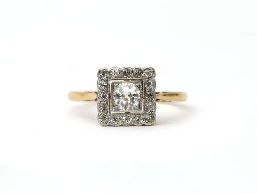 An 18 karat gold and platinum Art Deco diamond cluster ring....