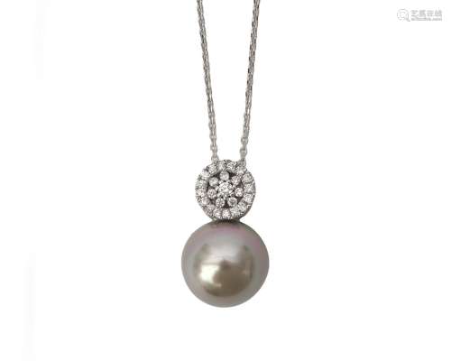A 14 karat white gold Tahiti pearl and diamond pendant with ...