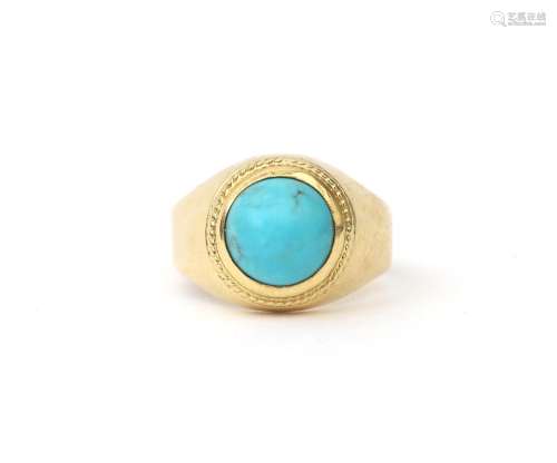 An 18 karat gold ring with cabochon cut turquoise. A domed d...