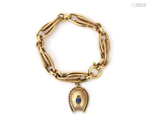 A 14 karat gold link bracelet with a gold locket. The locket...