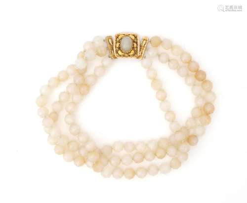 A white agate necklace to a 14 karat gold filigree clasp. A ...