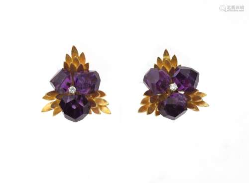 A pair of 14 karat gold amethyst and diamond floral earrings...