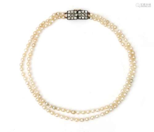 A natural pearl necklace to a rose cut diamond clasp. Incl. ...