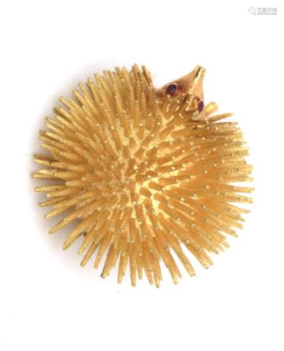 An 18 karat gold ruby hedgehog brooch, ca. 1970-`80. Spines ...
