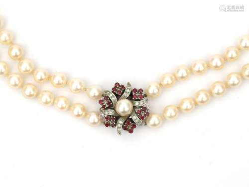 A cultured pearl necklace to a ruby and diamond white gold c...