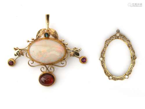 A gold brooch/pendant with opal and tourmaline. Featuring a ...