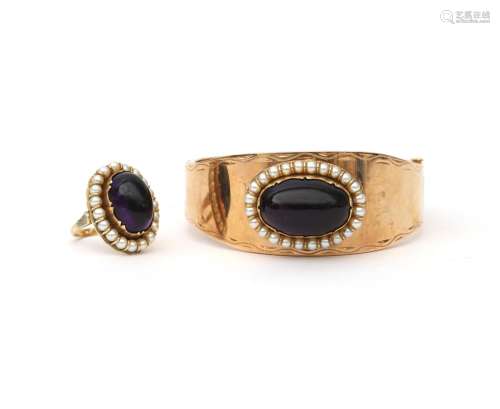 A 14 karat gold amethyst and pearl bangle with matching ring...