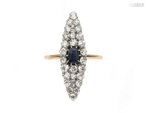 A 14 karat gold diamond and sapphire navette ring. Featuring...