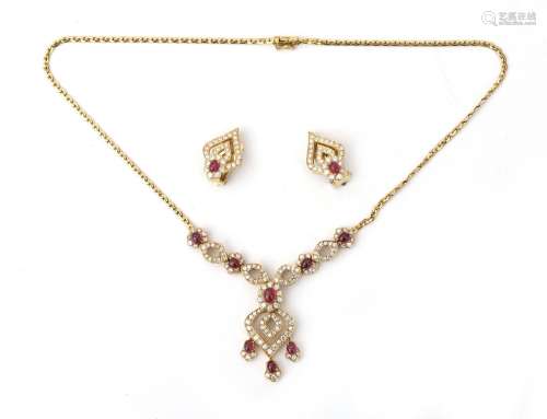 An 18 karat gold ruby and diamond necklace with matching ear...