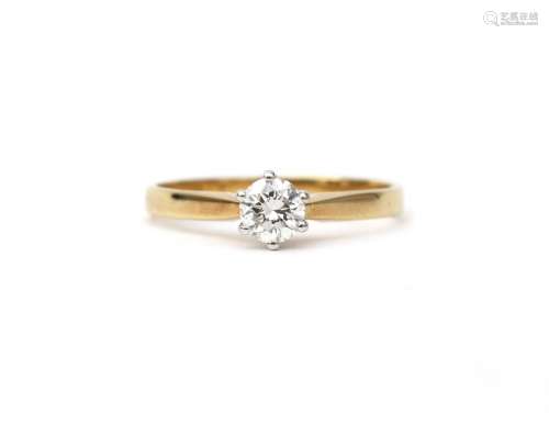 A 14 karat gold diamond solitaire ring, ca. 0.35 ct. Featuri...