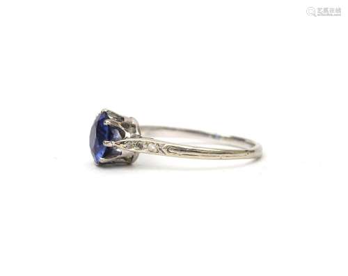 A sapphire and diamond solitare ring. Gross weight: 2.4 g. r...