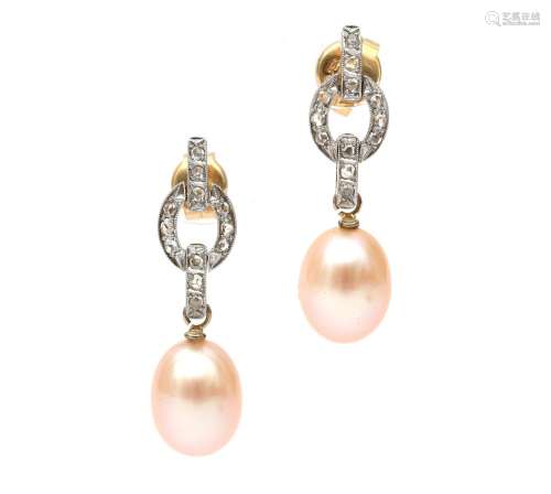 A pair of 14 karat gold and platinum diamond and pearl earri...