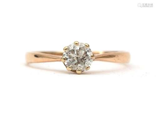 A 14 karat rose gold diamond solitaire ring. Featuring an ol...