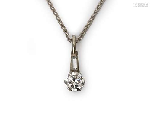 A diamond pendant with a white gold necklace. Featuring an o...