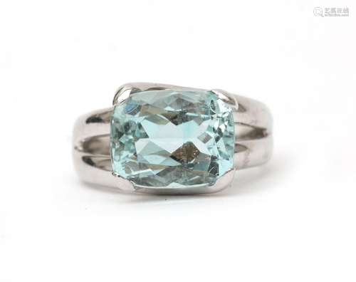 An 18 karat white gold aquamarine solitaire ring. Featuring ...