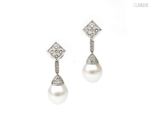 A pair of long whit gold pearl and diamonds ear pendants. Fe...