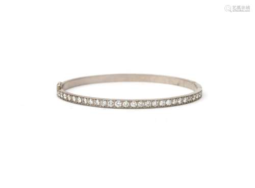 A 14 karat white gold diamond set bangle, ca. 2.80 ct. Featu...