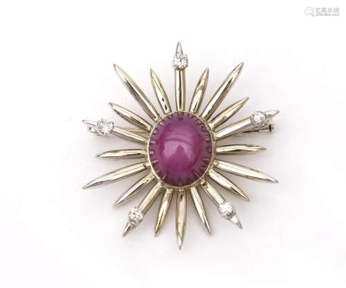 An 18 karat white gold diamond and star ruby comet brooch.ca...