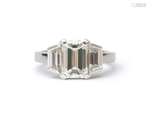 A platinum 950 trilogy ring with baquette cut diamonds, ca. ...